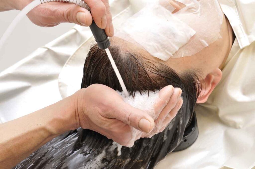 This image is about a lady undergoing medical treatment for infection in scalp.